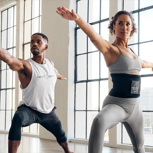 a man and a woman in a dance studio.